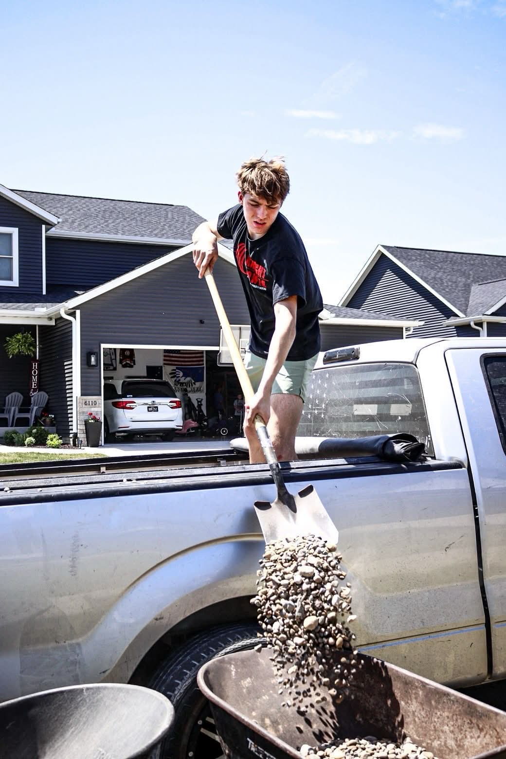 Shoveling rock from the truck